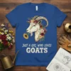Just A Girl Who Loves Goats text with a floral goat head graphic on a blue t-shirt