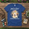Golden Retriever wearing a flower crown with text "Just a Girl Who Loves Golden Retrievers" on a blue t-shirt