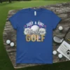 JUST A GIRL Who Loves GOLF text with a golf ball and floral accents on a royal blue t-shirt