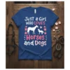 Just a Girl WHO LOVES Horses and Dogs text with horse and dog graphic, pink flowers, on a blue t-shirt