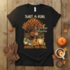 T-shirt design with text "JUST A GIRL Who loves HORSES AND FALL", featuring a brown horse, autumn tree, pumpkins, and