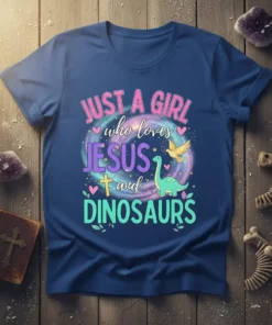 Just A Girl Who Loves Jesus and Dinosaurs text with cartoon Jesus cross and dinosaur graphic on a blue t-shirt