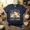 Just a Girl Who LOVES LAMBS text with cute cartoon lambs and gold hearts on a navy blue t-shirt
