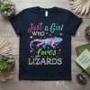 Just a Girl WHO Loves LIZARDS text with a colorful iguana graphic on a navy t-shirt