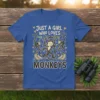 Just a Girl Who Loves Monkeys text with playful monkey graphics and bananas on a blue t-shirt