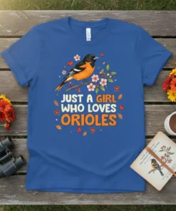 Blue t-shirt with the text "JUST A GIRL WHO LOVES ORIOLES" and an illustration of an oriole bird perched on