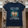 Just A Girl Who Loves Otters quote with cute otter graphics on a navy blue t-shirt