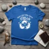 Just a Girl Who Loves Otters text with three playful white otters graphic on a blue t-shirt
