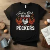 Black t-shirt with white text "Just a Girl WHO LOVES PECKERS" and graphics of three chickens and hearts