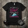 Just a Girl Who Loves Snowmobiling quote with a snowmobiler graphic and hearts, on a black t-shirt