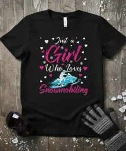 Just a Girl Who Loves Snowmobiling quote with a snowmobiler graphic and hearts, on a black t-shirt