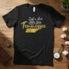 Just a Girl Who Loves Tennessee text design with golden state outline graphic on black t-shirt