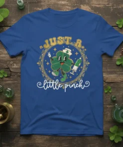 Just a Little Pinch nurse t-shirt design featuring a cartoon shamrock holding a syringe and wearing a nurse's cap