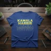 Blue t-shirt with "KAMALA HARRIS" in bold gold lettering and a graphic of cheering supporters with raised arms