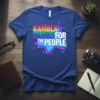 Kamala Harris For The People text in colorful, retro-style font on a blue t-shirt, political campaign apparel