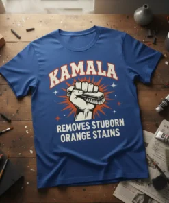 Kamala Removes Stubborn Orange Stains text design with a raised fist holding a scrub brush graphic on a blue t-shirt