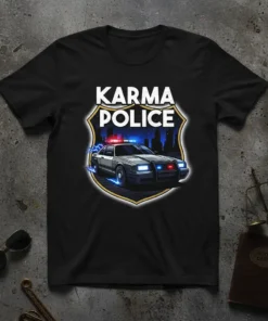 Karma Police t-shirt design with a retro police car, flashing lights, and city skyline in a badge shape