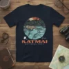 Katmai National Park T-Shirt with a bear fishing in a river, set against a sunset and forest backdrop. Includes text