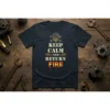 Keep Calm And Return Fire quote with skull graphic on a dark navy t-shirt, designed for mechanics