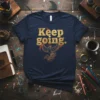 Keep Going. inspirational quote t-shirt with a golden phoenix graphic and flames design