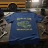 Navy blue t-shirt with yellow distressed graphic of a school bus and the text "KEEP MY BUS CLEAN I KNOW