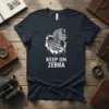 Keep On Zebra text with a jumping zebra graphic on a dark t-shirt