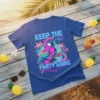 Keep The Party Going text with a colorful parrot playing a guitar on a blue t-shirt design, featuring tropical palm