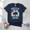 Keeper Of The Gender Auntie Loves You text with messy bun, sunglasses, pacifier, and footprints graphic on a navy t-shirt