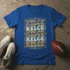 Blue t-shirt with "KELCE KELCE KELCE KELCE KELCE" repeated vertically in bold, distressed gold and silver lettering, framed by ornate