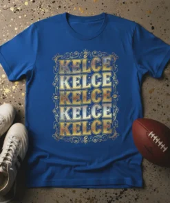 Blue t-shirt with "KELCE KELCE KELCE KELCE KELCE" repeated vertically in bold, distressed gold and silver lettering, framed by ornate