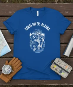 Kenai River Alaska text with a jumping salmon graphic on a blue t-shirt, ideal for fishing enthusiasts