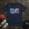 Navy t-shirt with "KICKBALL USA" text in white and blue, overlaid on a distressed American flag graphic