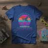 Kindergarten Level Complete t-shirt with retro rocket ship and game controllers, vibrant sunset background