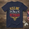 Navy blue t-shirt with "KISS ME I'm a VETERAN" text in yellow and red, featuring an anchor and wings graphic