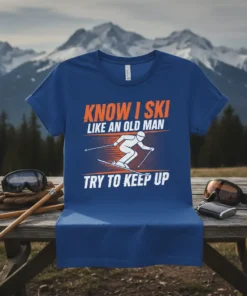 T-shirt with "Know I Ski Like An Old Man Try To Keep Up" text and a skier graphic