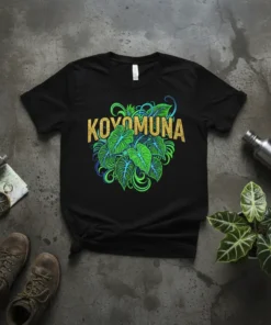 Black t-shirt with the word KOYOMUNA in gold glitter above a cluster of vibrant green philodendron leaves
