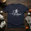Lacrosse heartbeat graphic with player silhouette and crossed sticks, on a navy blue t-shirt