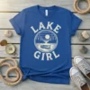 Blue t-shirt with "Lake Girl" text and a vintage circular graphic of a lake, trees, moon, and boat
