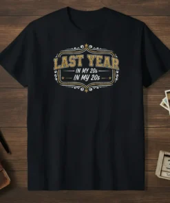Last Year In My 20s In My 20s text design on a black t-shirt, featuring vintage gold and white typography