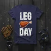 Navy blue t-shirt with "LEG DAY" text and a roasted chicken leg graphic, perfect for gym humor and workout motivation