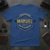 Legends Are Named Manuel Aged to Awesomeness T-Shirt design with gold and black text on a blue shirt