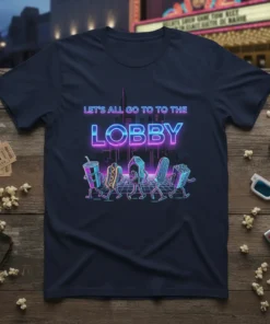 T-shirt with neon text "LET'S ALL GO TO THE LOBBY" and cartoon walking movie snacks like hot dog, popcorn, and