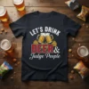 Let's Drink Beer & Judge People text and graphic with beer mugs and hops on a black t-shirt