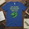 T-shirt with yellow text "Let's Eat Kids. Let's Eat, Kids. Punctuation Saves Lives." above a green dinosaur skull graphic