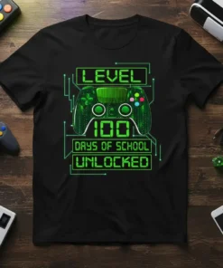 T-shirt with "LEVEL 100 DAYS OF SCHOOL UNLOCKED" text and a video game controller graphic in neon green
