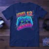 Level 12 Unlocked gaming birthday t-shirt with a blue game controller and neon geometric background