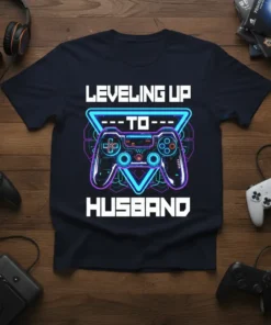 Leveling Up To Husband text with a video game controller graphic on a navy t-shirt