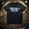 Navy blue t-shirt with white and blue distressed text reading "LIBERALS SUCK" and three stars below