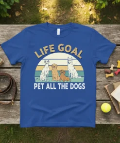 LIFE GOAL PET ALL THE DOGS text with four dogs sitting in front of a sunset graphic on a blue