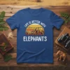T-shirt featuring geometric elephants and the text "Life Is Better With Elephants" against a sunset graphic
